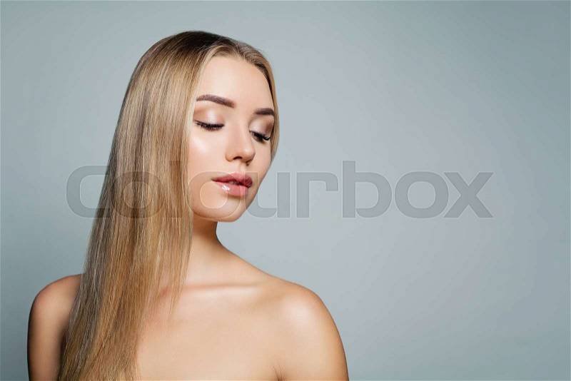Beautiful blonde straight hair model. Pretty woman portrait. Facial treatment, haircare and cosmetology concept, stock photo