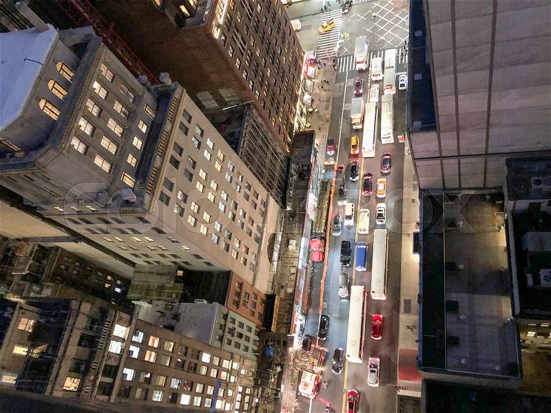 Overhead aerial view of city traffic at night in New York Street, stock photo