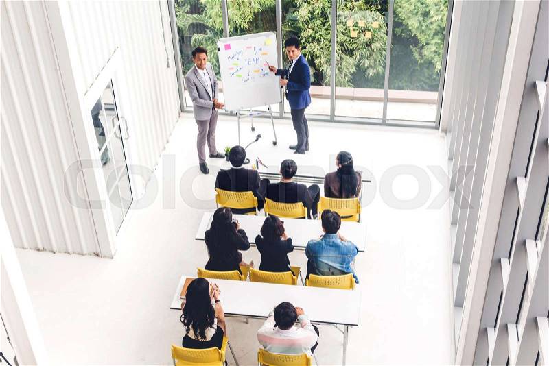 Group of casual business meeting and discussing with laptop computer.creative business people presenting and planning in modern workloft.Teamwork concept, stock photo
