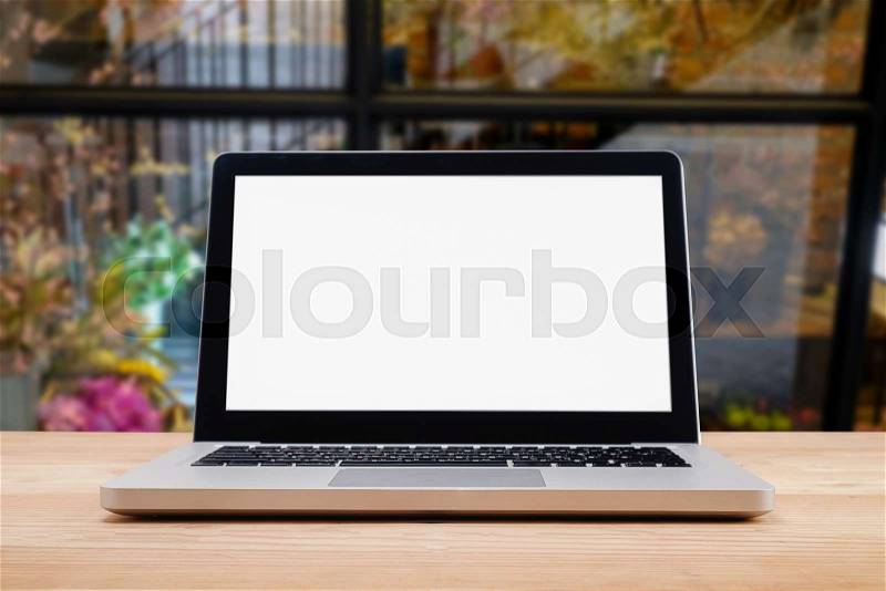 Computer with white screen on table with blur background. Technology concept. , stock photo