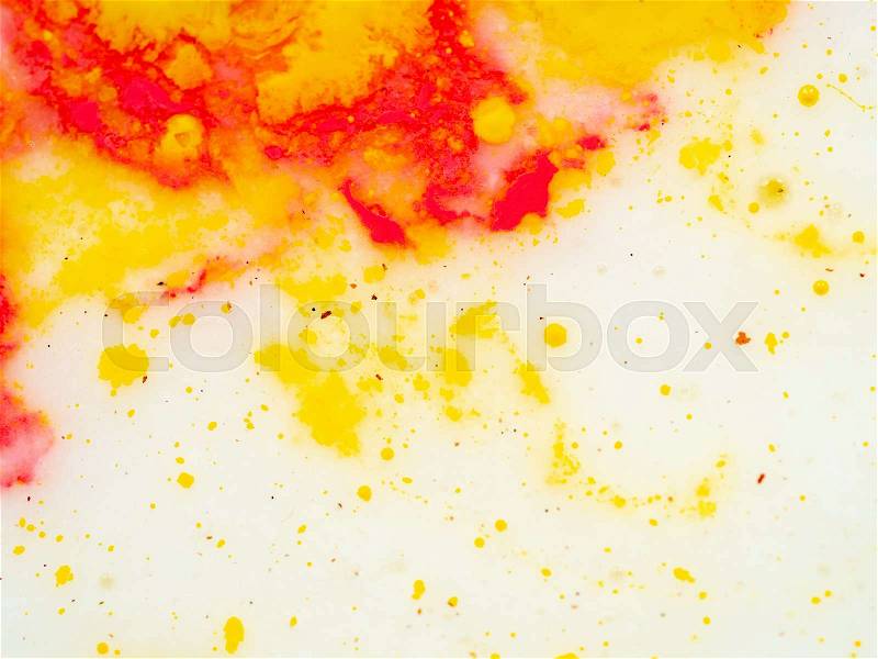 Splashes of red and yellow paint, abstract background. Close up shot. Blurred background. Abstract pattern on white background. Colourful splashes of yellow and red ..., stock photo