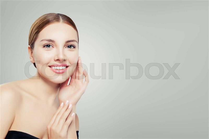 Smiling girl with healthy clear skin. Facial treatment, skincare and cosmetology concept. , stock photo