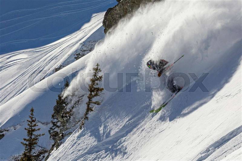 Skier in powder snow catching by his spray, stock photo