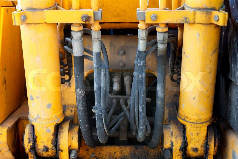 Hydraulic system, steel tubes and rubber parts of lifting mechanism excavator, stock photo