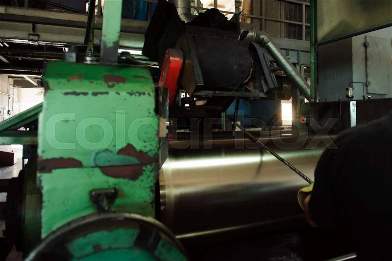 Worker tests the production. A rubber factory, stock photo