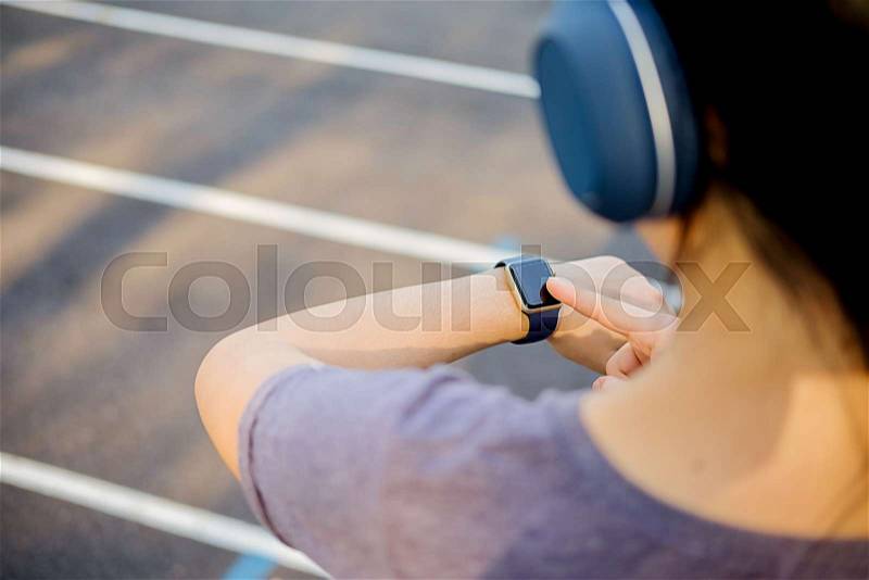 Sport watch run woman checking smartwatch tracker, stock photo