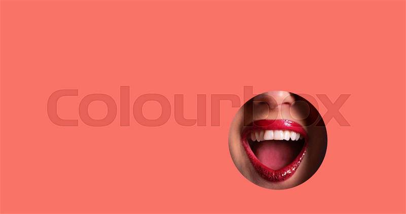 Red lips and shiny smile through hole in living coral paper background. Make up artist, beauty cosmetics sale. Spring, woman day concept. Beauty salon advertising ..., stock photo