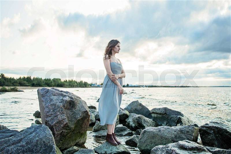 Nice girl in prom dress outdoors portrait, stock photo