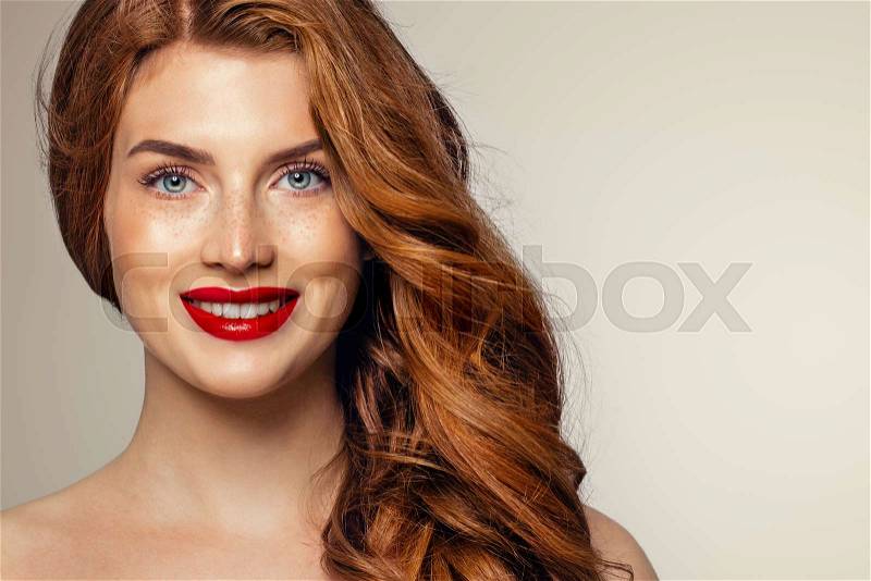 Candid woman with freckles and ginger hair. Natural redhead girl lifestyle portrait, stock photo