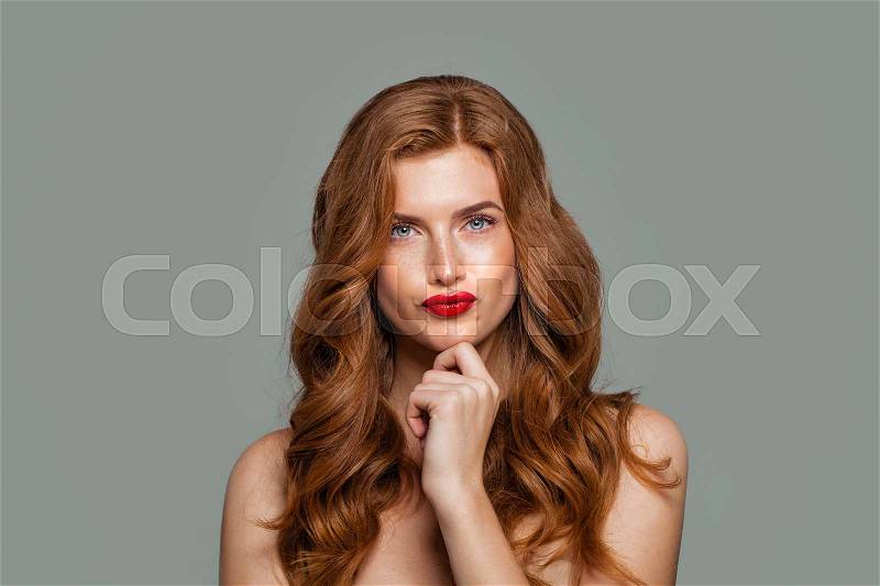 Red head woman thinking. Doubt and choice concept. Expressive facial expressions, stock photo
