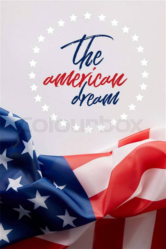 Top view of united states of america flag and the american dream lettering on white surface , stock photo