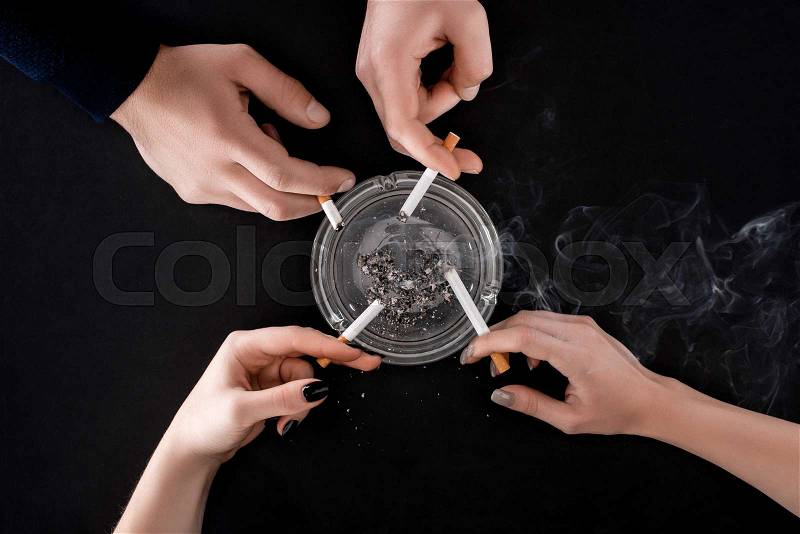 Top view of smoking people holding cigarettes , stock photo