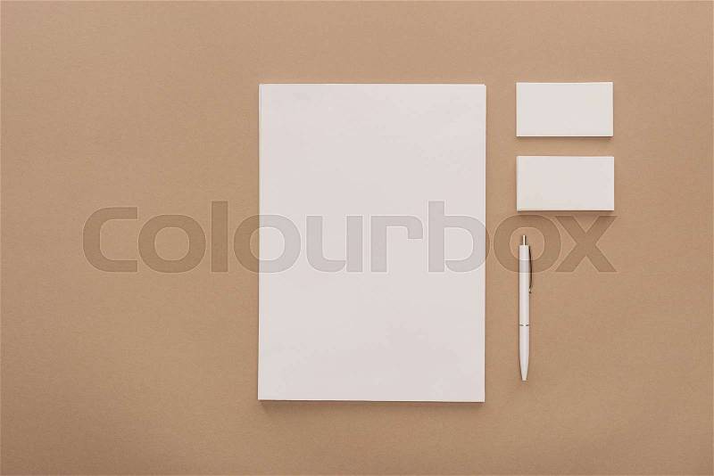 Top view of empty sheet of paper, cards and pen , stock photo