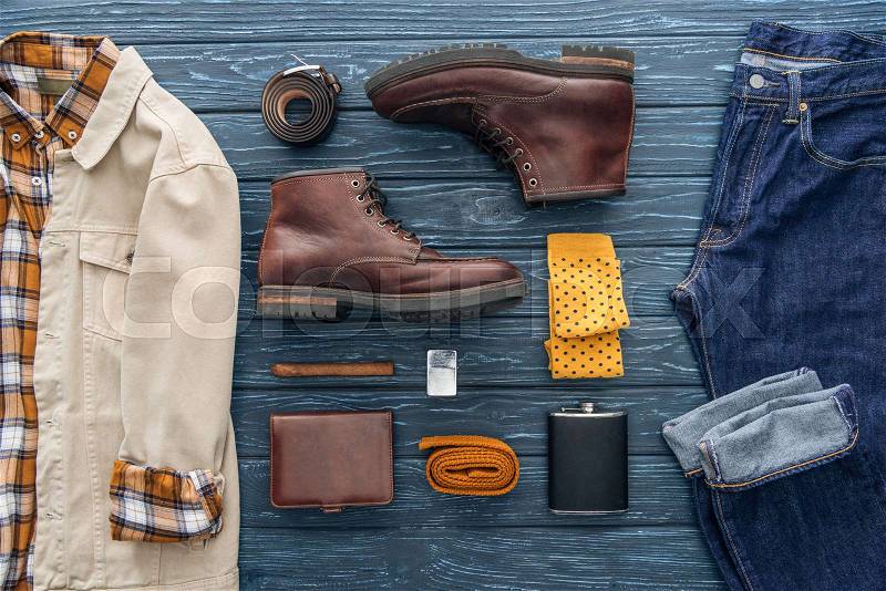 Flat lay with men's clothing, shoes, cigar and accessories on wooden background, stock photo