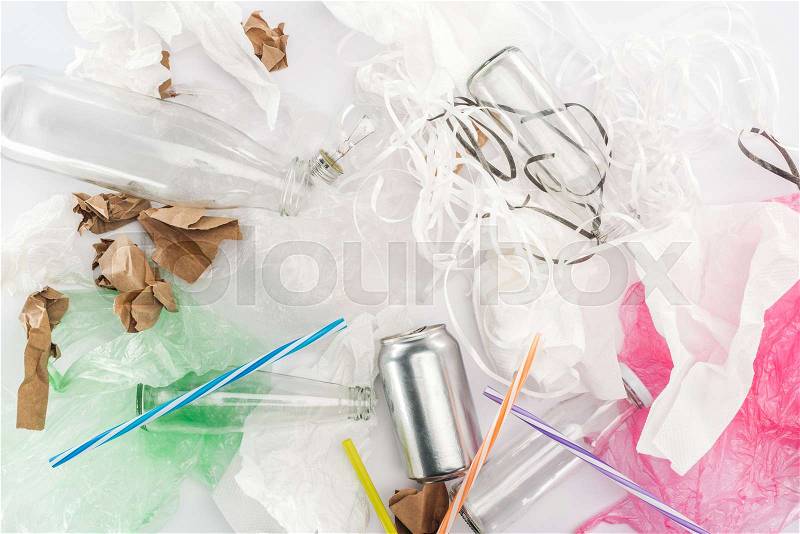 Top view of can, glass bottles, paper strips, paper, bulb, plastic tubes and plastic bags, stock photo