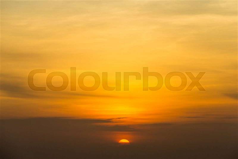 Colorful sunset sky over tranquil sea surface, stock photo