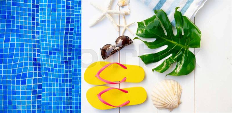 Summer flat lay scenery near pool with flip flops, copy space, stock photo