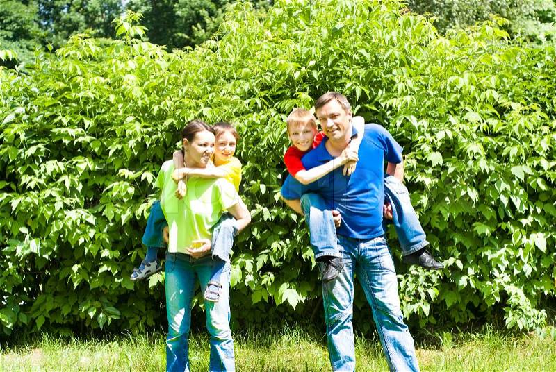 Family of four on the nature, stock photo