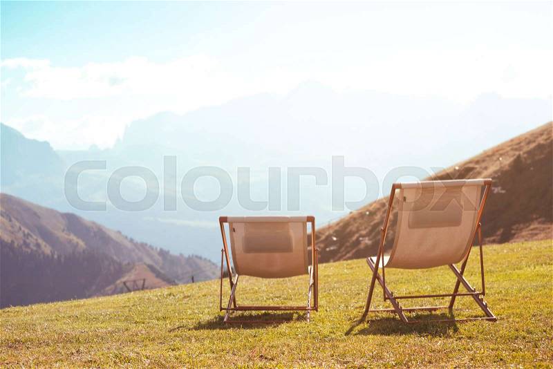 Relax - two chairs in the mountains. Seceda Dolomites, Italy, stock photo