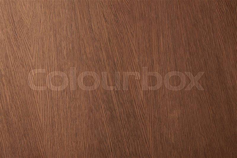 Top view of brown desk surface with wooden texture, stock photo