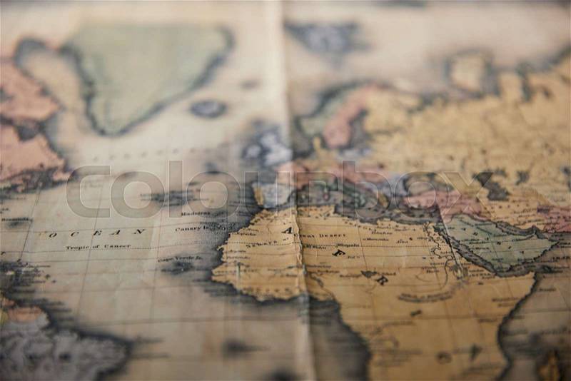 Selective focus of world retro map on table, stock photo