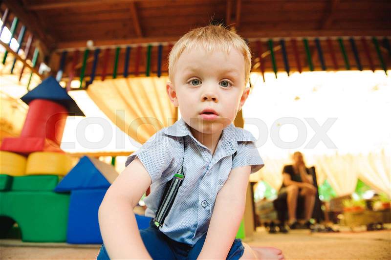 A modern children playground indoor. Boy have fun, stock photo