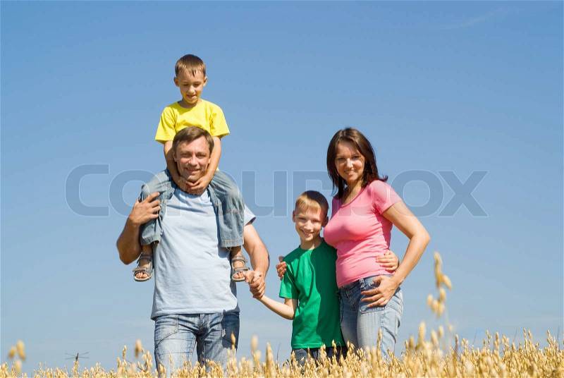 Happy family of four, stock photo