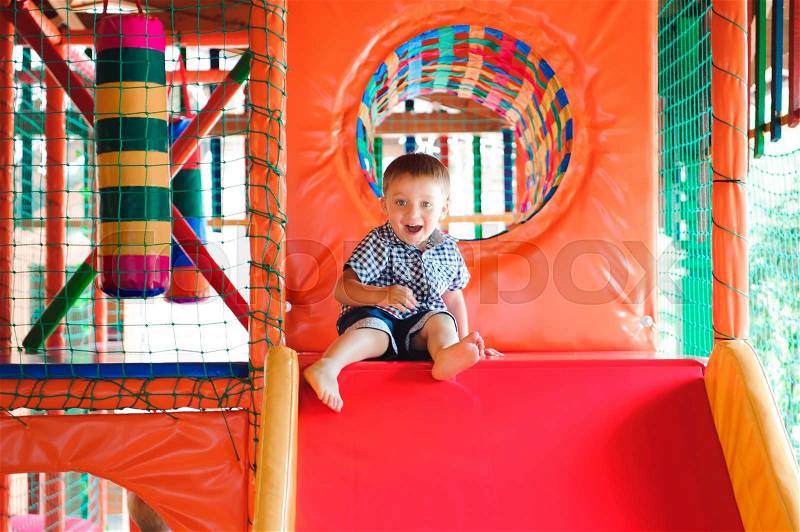 Indoor playground with colorful plastic balls for children, stock photo