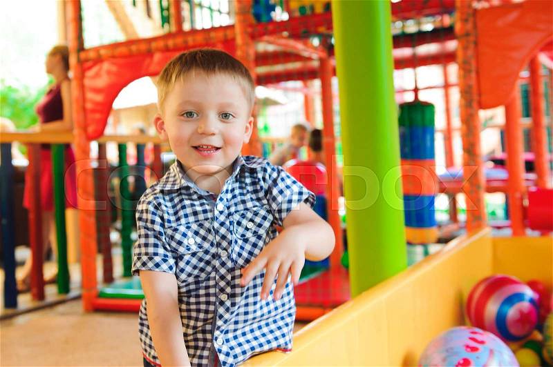 Indoor playground with colorful plastic balls for children, stock photo