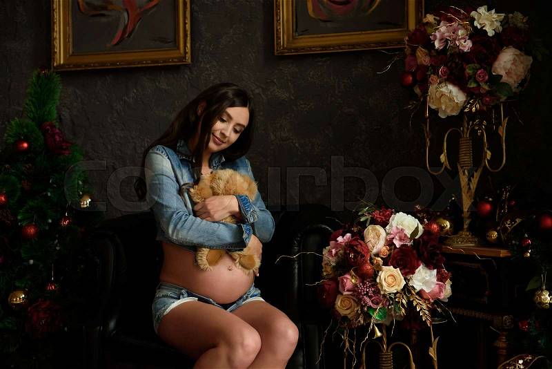 Pregnancy, motherhood, people and expectation concept - close up of happy pregnant woman with big belly, stock photo
