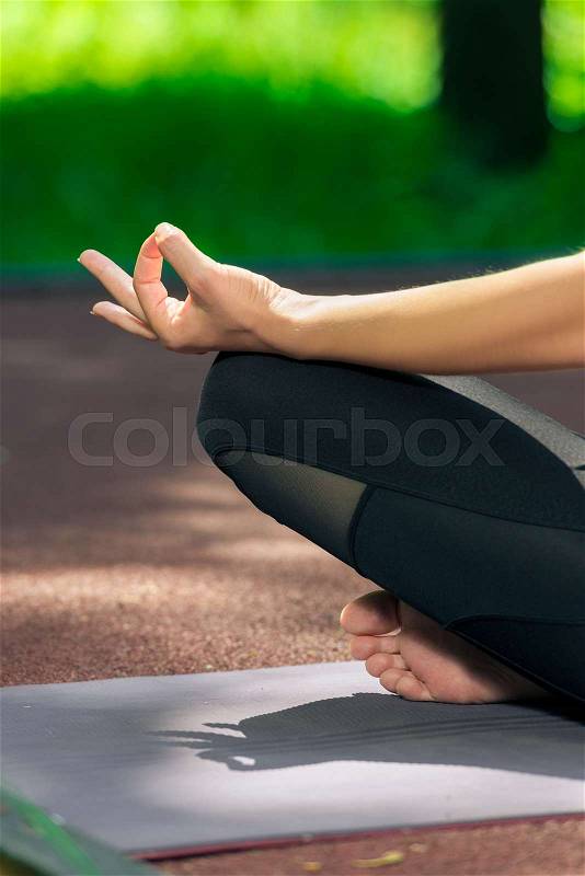 Female hand close up lotus pose yoga asana, stock photo