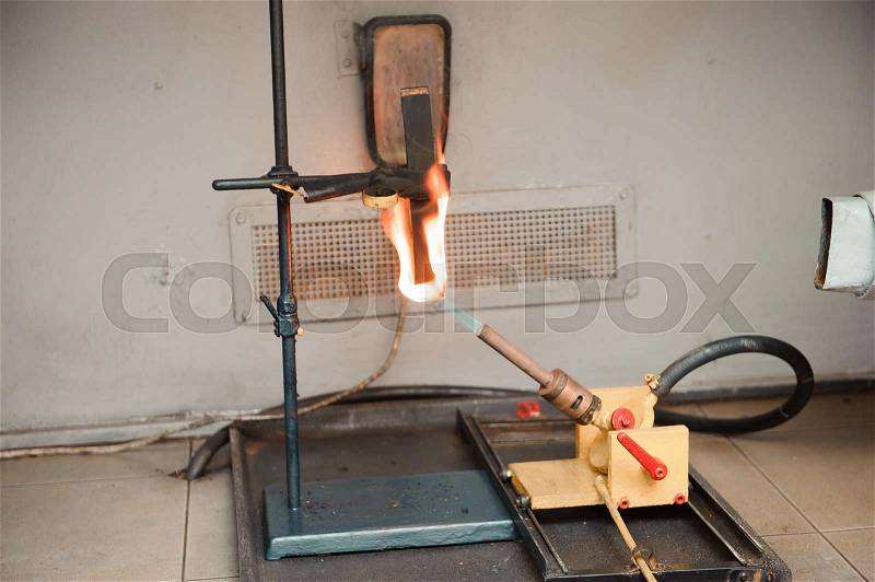Engineer set up and testing old machine in factory, engineering and industrial concept, stock photo