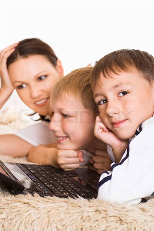 Mom and sons with laptop, stock photo