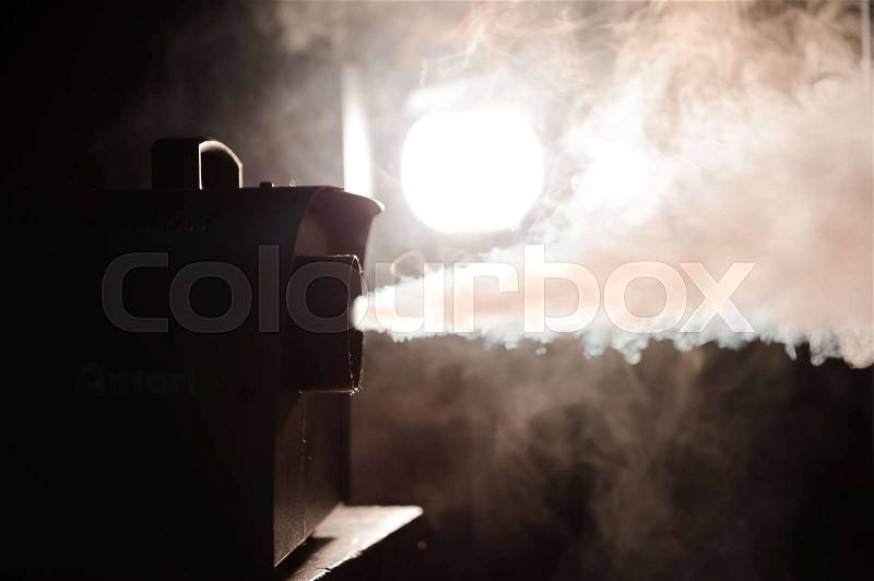 Smoke machine in action. Smoke in the dark, stock photo