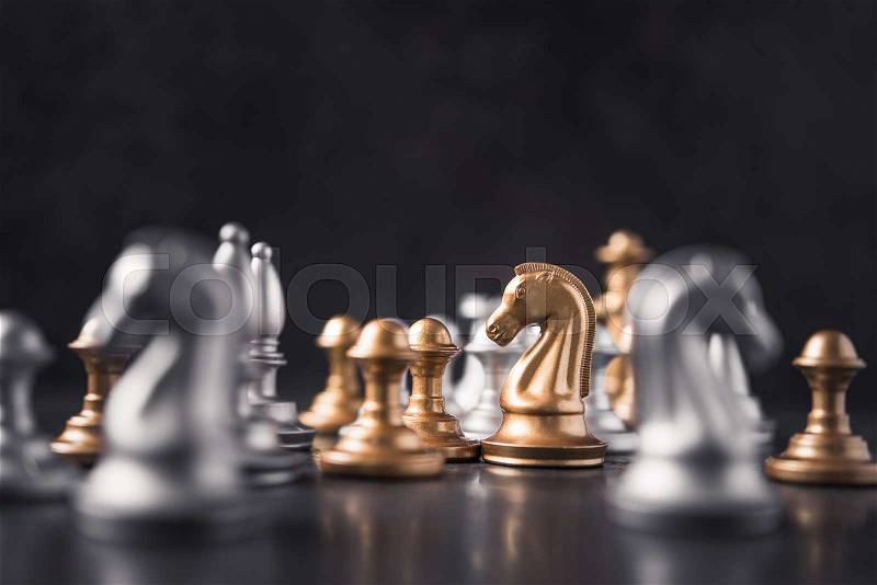 Chess knight horse on the chessboard, stone background. selective focus, stock photo