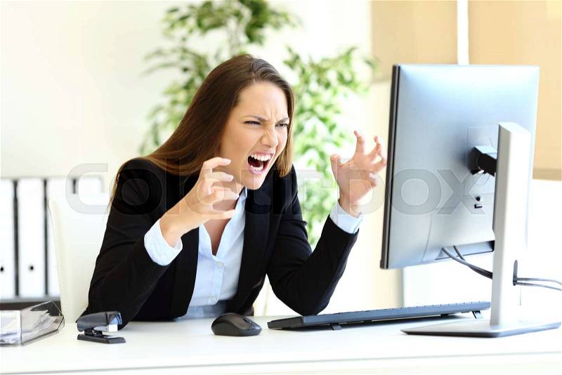 Angry office worker loosing control checking computer content, stock photo