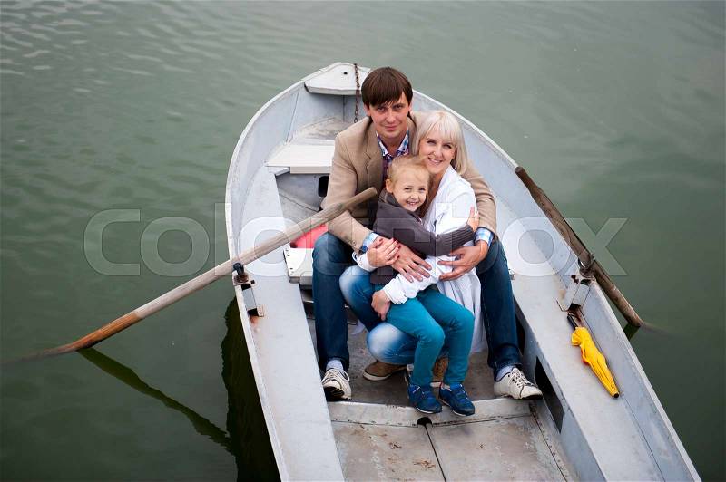 Portrait of a nice family on the boat, stock photo