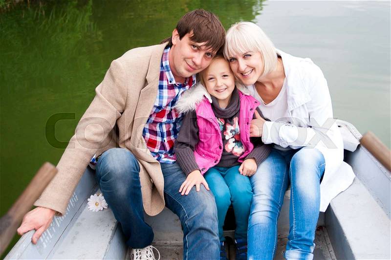 Portrait of a nice family on the boat, stock photo