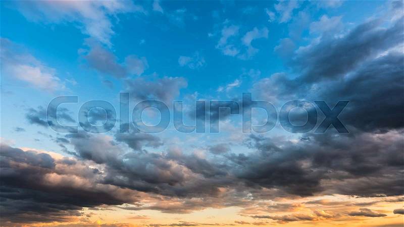 Stunning view of cloudy sunset sky. Beautiful evening sky background, stock photo