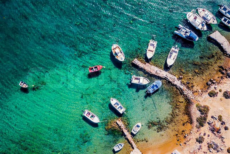 Top aerial view of small fishing boats moored in the harbor, Paros island, Greece, stock photo