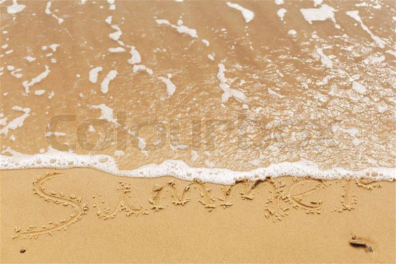 Hello summer concept. Summer text written on sandy beach and sea waves. Relaxing on tropical island. Summer vacation concept, stock photo