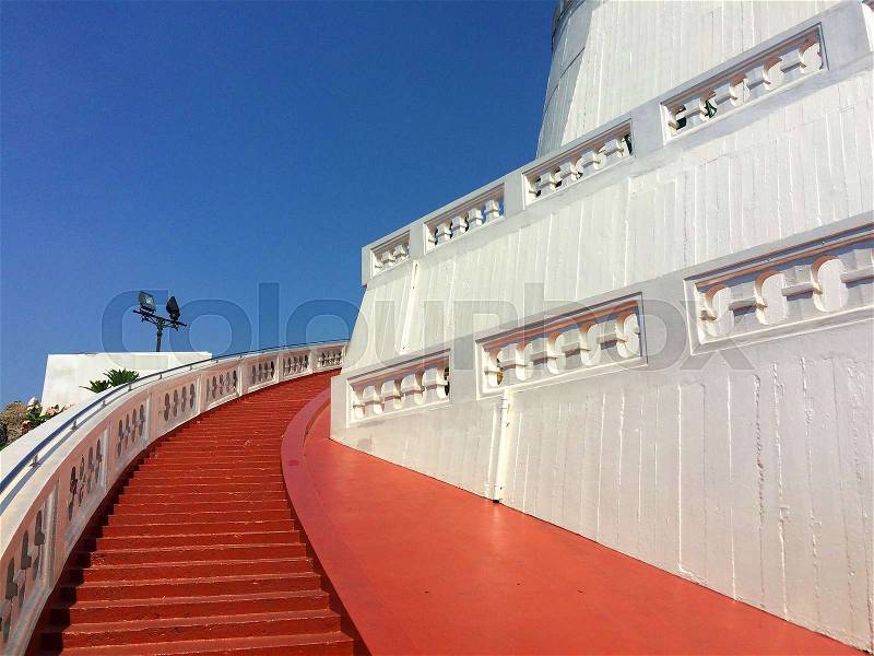 The White Pagoda(Chedi) and Red stairs of the mountain temple, Bangkok Thailand, stock photo