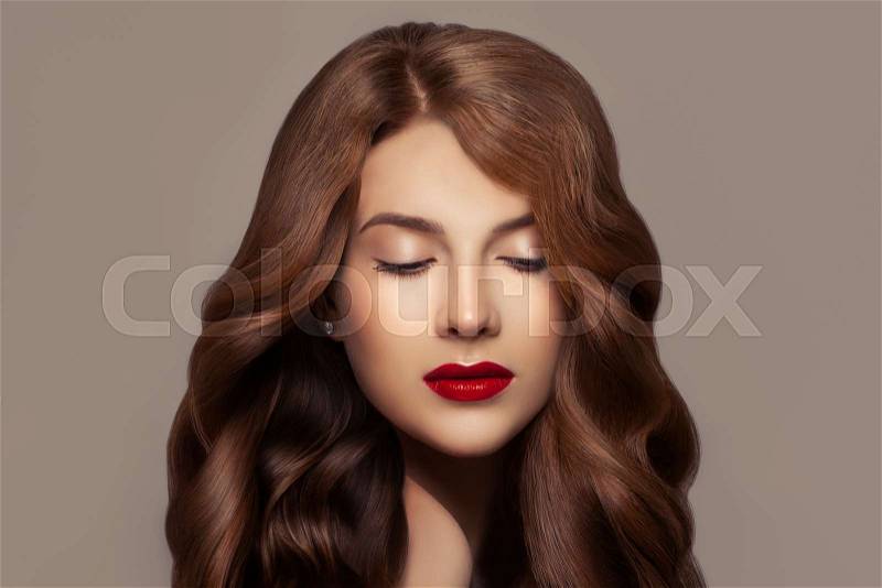 Pretty redhead woman. Beautiful redhead girl with wavy haircut and perfect makeup, cute face closeup, stock photo
