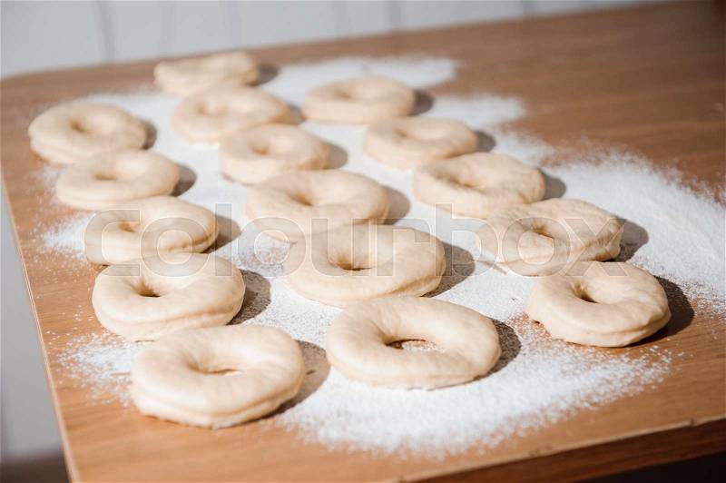 Chef preparing dough - cooking donuts process in the kitchen, stock photo