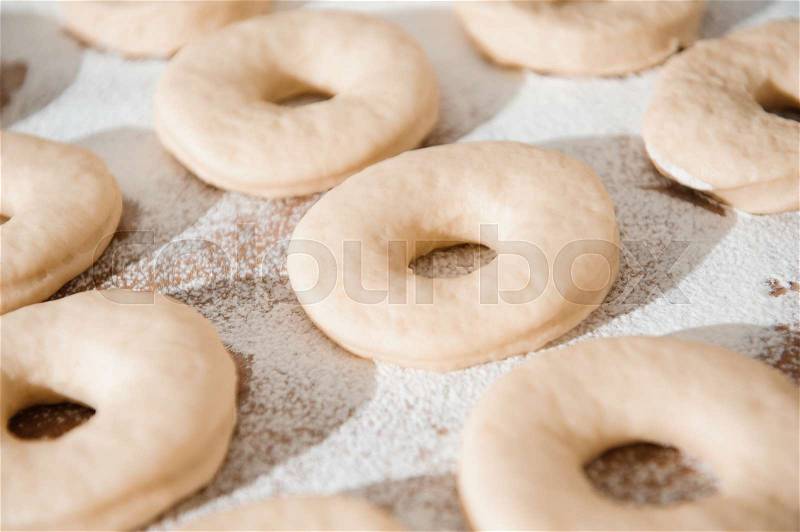 Chef preparing dough - cooking donuts process in the kitchen, stock photo