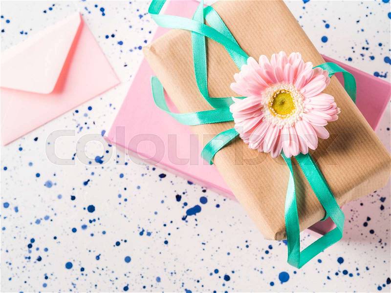Stacked gift boxes with flowers. Pastel colors. Woman, mother, Valentine day greeting card. Event invitation, stock photo