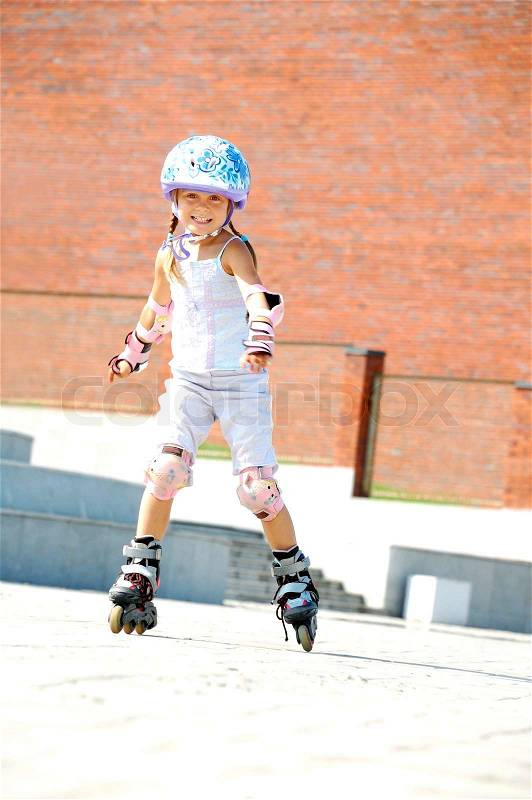 Child on inline rollerblade skates, stock photo