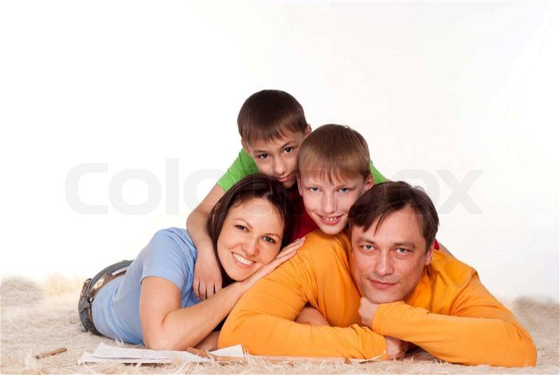 Happy family on a carpet, stock photo