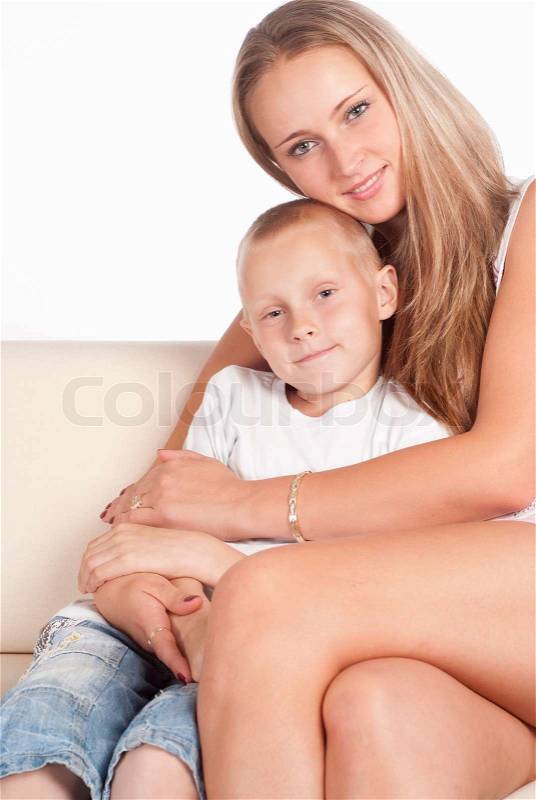 Mom and son on sofa, stock photo