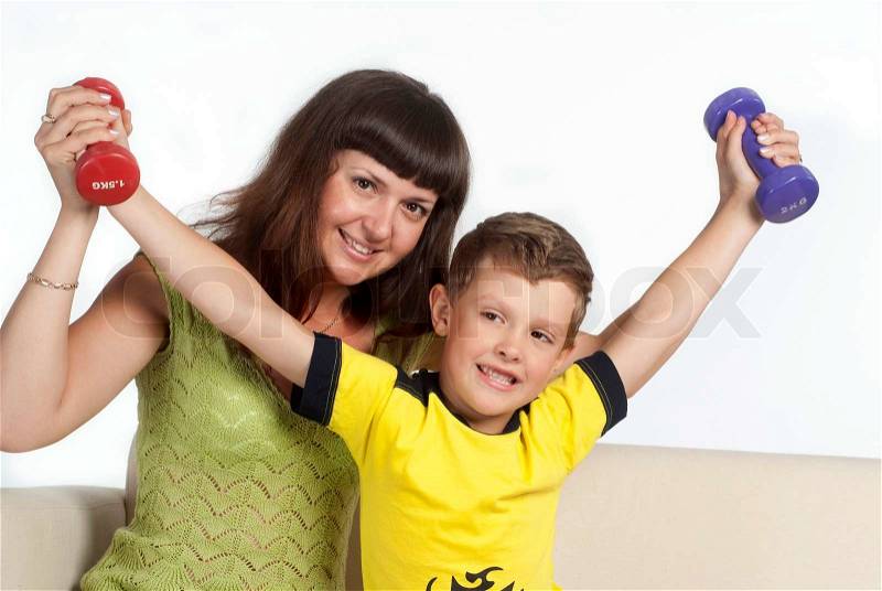 Son keeping fit with mother, stock photo